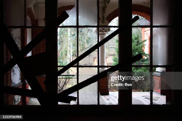 barricaded window in an abandoned building - inner doom stock pictures, royalty-free photos & images