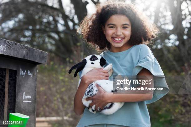girl with her rabbit - lapereau photos et images de collection