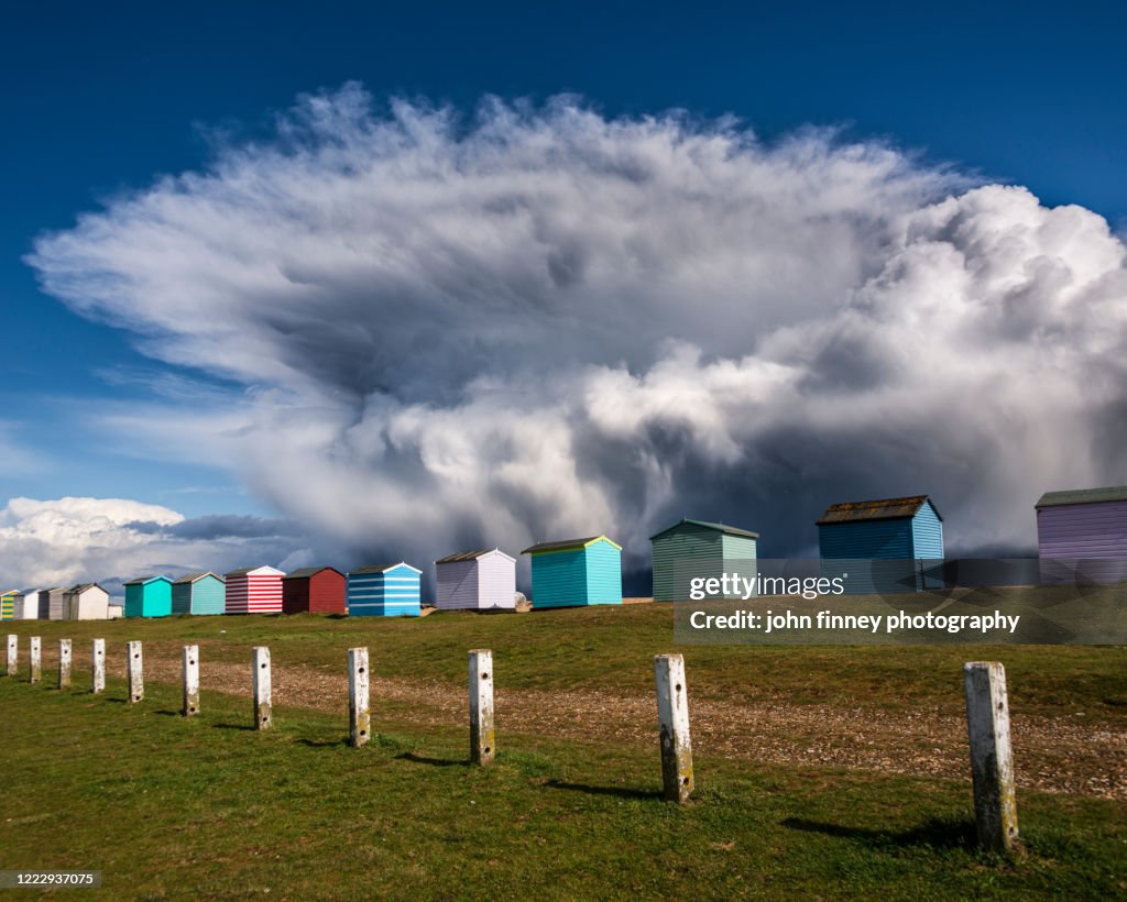 The Beach huts of Folkestone and Storm katie. Kent, UK