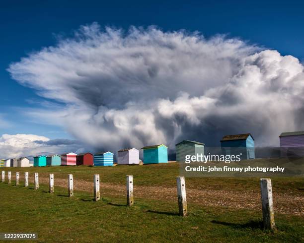 the beach huts of folkestone and storm katie. kent, uk - folkestone stock pictures, royalty-free photos & images