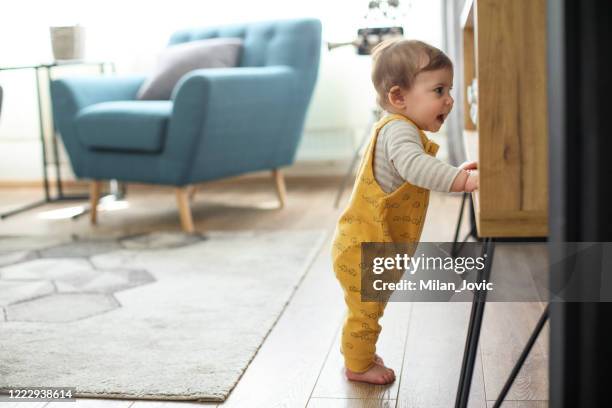 baby's first steps - baby first steps stock pictures, royalty-free photos & images