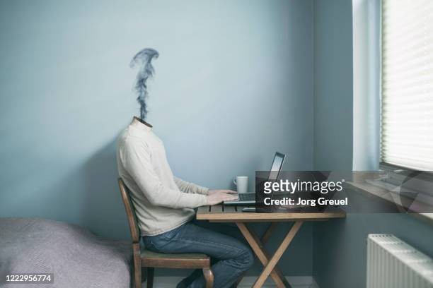 headless man working at home, smoke coming out of his neck - enge stock-fotos und bilder