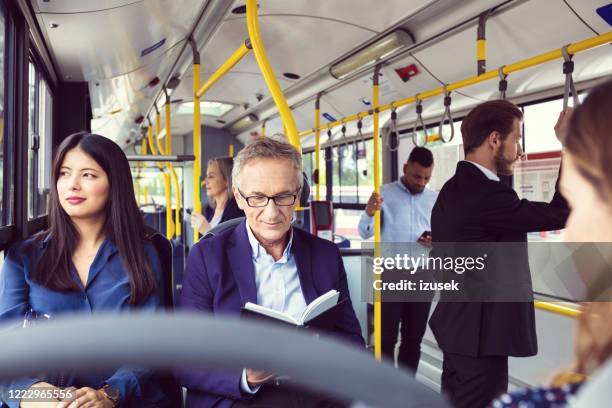 Reviewing Notes While Commuting 30,987 Commuting By Bus Stock Photos, High-Res Pictures, and Images ...