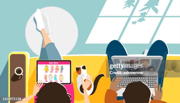 young man and woman with computers - cozy stock illustrations
