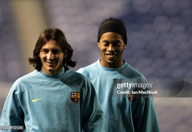 Lionel Messi and Ronaldinho of Barcelona are seen during a team training session at Ibrox Stadium ahead of their Champions League, Group E match...