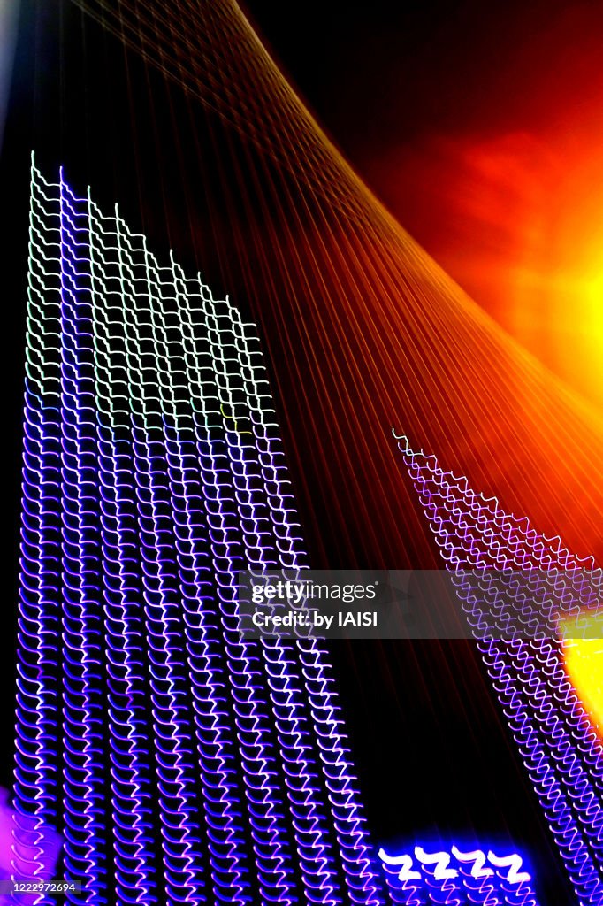 City lights, purple electric light effects on the cantilever spar cable-stayed bridge, Chords bridge abstract