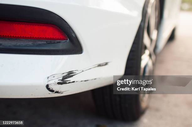 rear car bumper with damaged paint - scratched car stock pictures, royalty-free photos & images