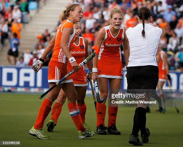 Netherlands players discuss a decision with the referee during the Women's EuroHockey 2011 final match between Netherlands and Germany at Warsteiner...