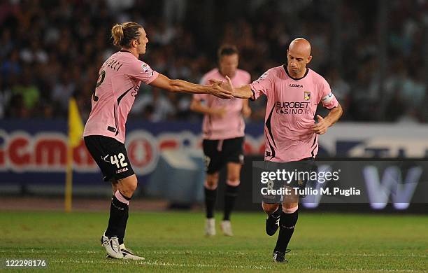 Giulio Migliaccio of Palermo celebrates with Federico Balzaretti after scoring a goal during the pre season friendly match between SSC Napoli and US...