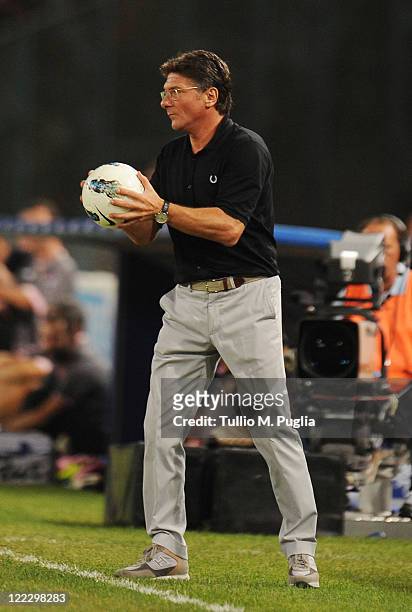 Coach Walter Mazzarri of Napoli holds a ball during the pre season friendly match between SSC Napoli and US Citta di Palermo at Stadio San Paolo on...