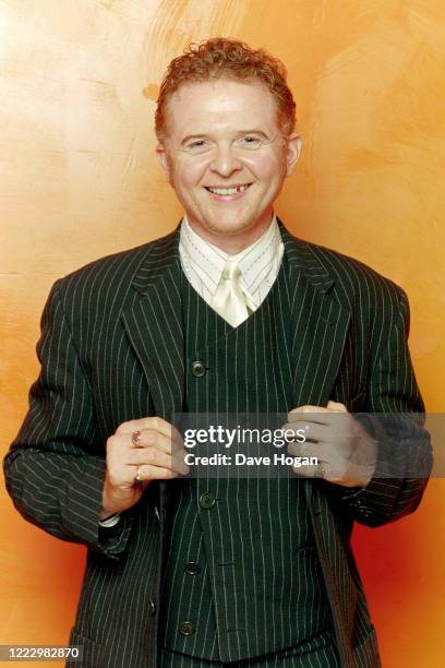 Singer Mick Hucknall of Simply Red poses for a portrait, 1999