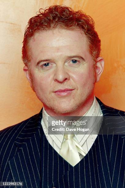 Singer Mick Hucknall of Simply Red poses for a portrait, 1999