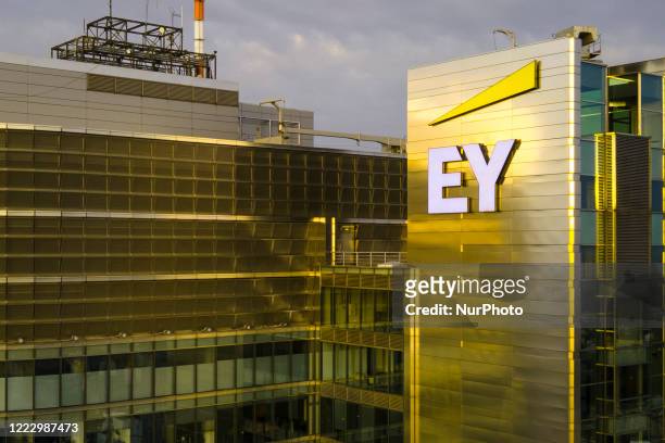 The Ernst and Young logo is seen on the Rondo 1 building on the Rondo ONZ roundabout on June 11, 2020 in Warsaw, Poland.