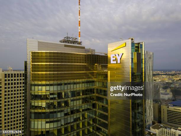 The Ernst and Young logo is seen on the Rondo 1 building on the Rondo ONZ roundabout on June 11, 2020 in Warsaw, Poland.