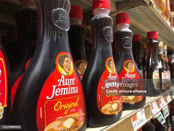 June 2020, US, New York: Syrup bottles from "Aunt Jemima" are in a supermarket. US food giant Pepsi is giving its 130-year-old "Aunt Jemima" brand a...