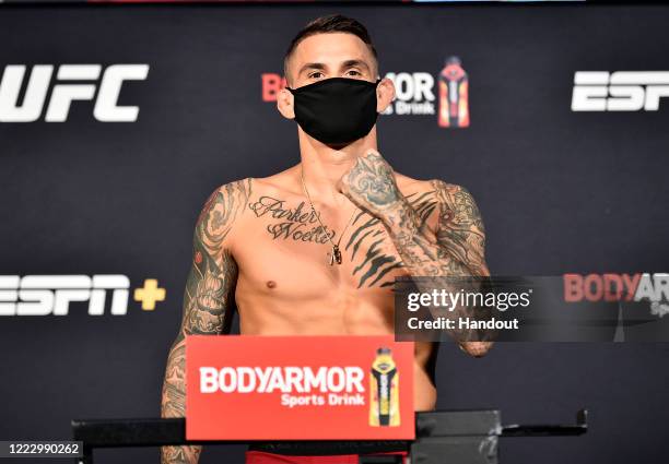 In this handout image provided by UFC, Dustin Poirier poses on the scale during the UFC weigh-in at UFC APEX on June 26, 2020 in Las Vegas, Nevada.