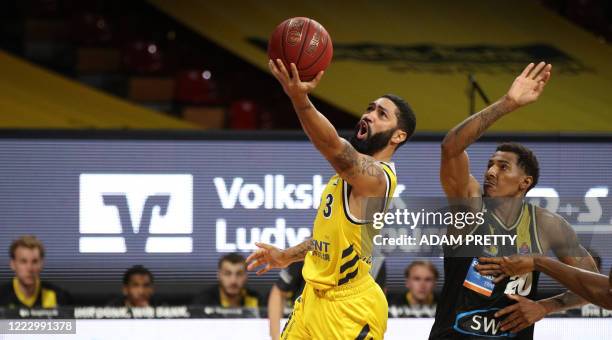 Alba Berlin's US point guard Peyton Siva and MHP Riesen Ludwigsburg's US power forward Thomas Wimbush vie during the German basketball Bundesliga...