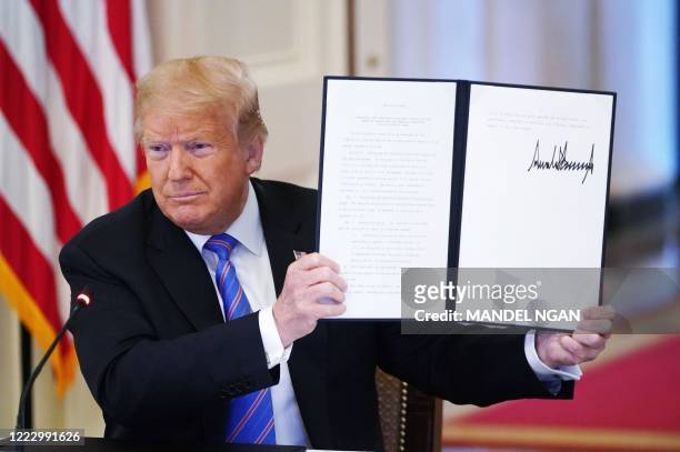 President Donald Trump holds an executive order on "Continuing the President's National Council for the American Worker and the American Workforce...
