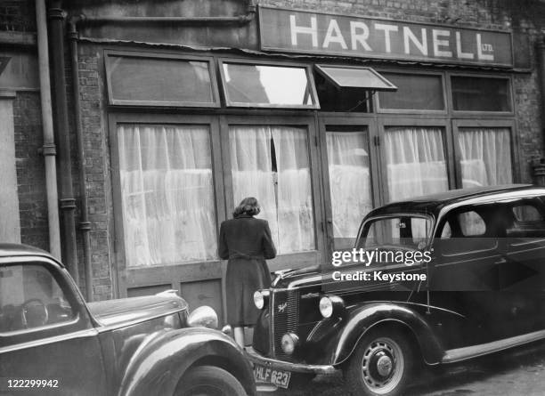 The Bruton Lane salon of British fashion designer Norman Hartnell in Mayfair, London, 24th October 1947. While Hartnell and his staff work on the...