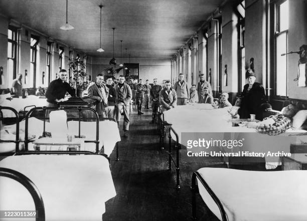 American Ward at Fourth Scottish General Hospital where most Patients are Influenza Cases from incoming Convoys, the Red Cross has a staff of...
