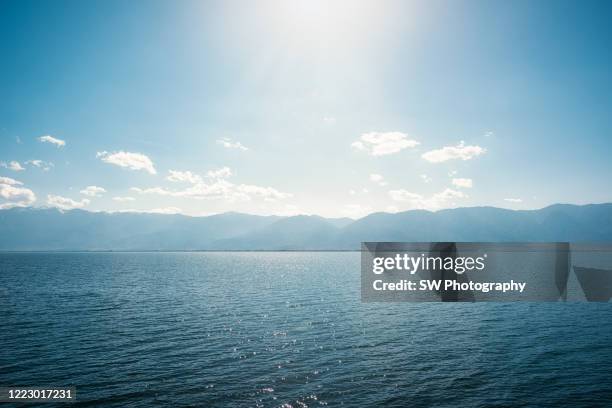 tranquil view of er hai lake in yunnan, china - lake horizon stock pictures, royalty-free photos & images