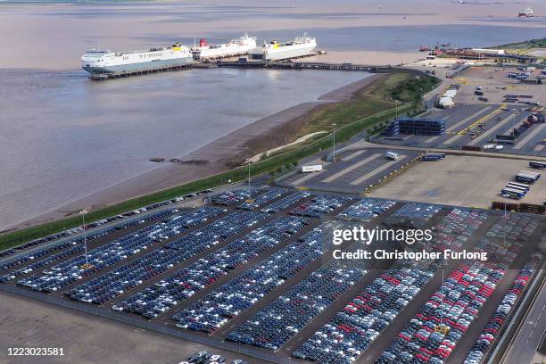 Imported vehicles sit at the docks near Immingham on May 05, 2020 in Grimsby, England. During the coronavirus lockdown new car sales have dropped...