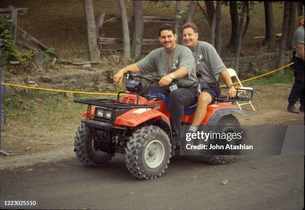 Concert security staff members Dave Lombardo and George Griffin are shown on an ATV at Woodstock 94 in Saugerties, New York on August 14, 1994.