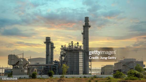 gas turbine electrical power plant during sunset and twilight time - gas turbine electrical power plant stock pictures, royalty-free photos & images