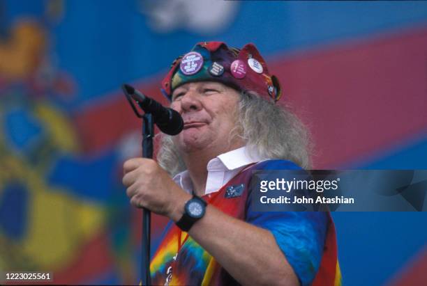 Wavy Gravy is shown speaking to the crowd while on stage at Woodstock 99 in Rome, New York on July 25, 1999.