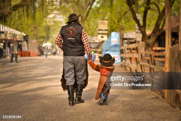 father and son gauchos - gaucho stock pictures, royalty-free photos & images
