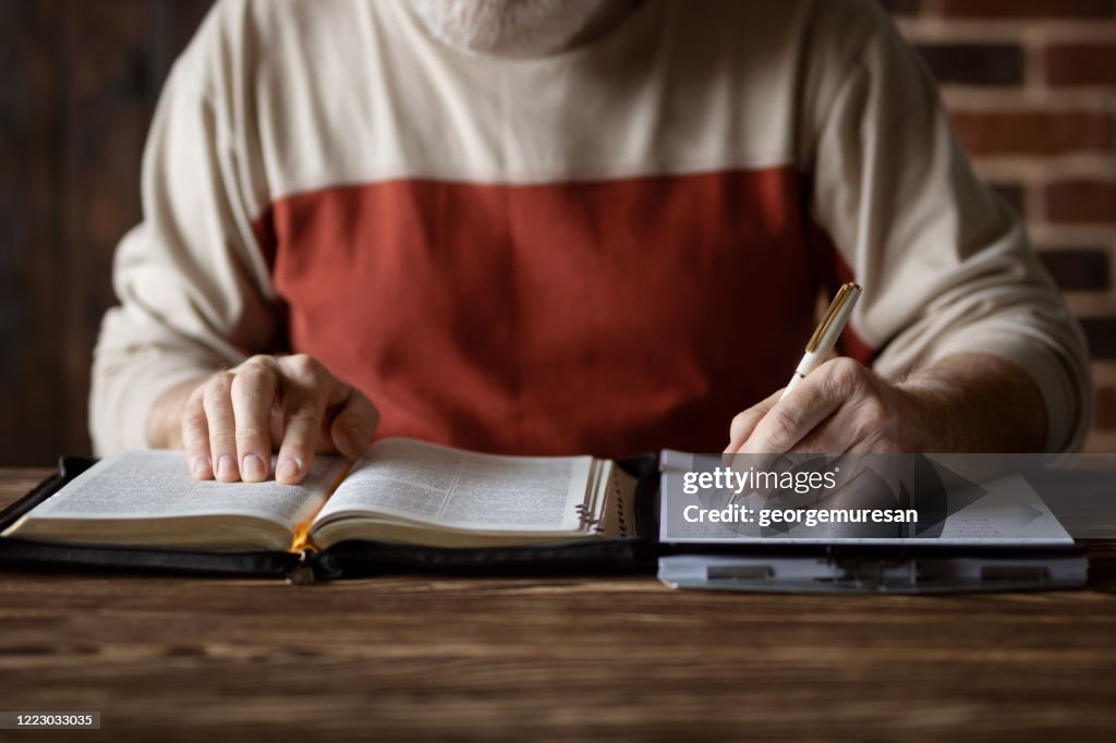 Taking notes and study of the Holy Bible