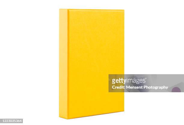 blank yellow box template isolated over white background - libro cerrado fotografías e imágenes de stock