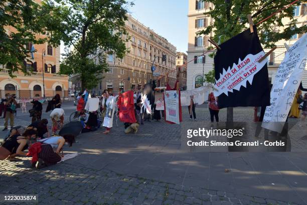 Women from the Non Una Di Meno collective return to the square after lockdown, to protest against rape and discrimination, on June 26, 2020 in Rome,...