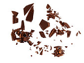 Falling Chocolate pieces and  shavings  isolated on white background