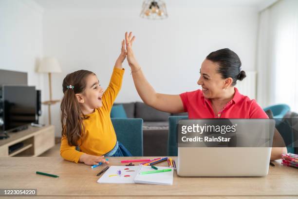 learning , high five success - back to school mom stock pictures, royalty-free photos & images
