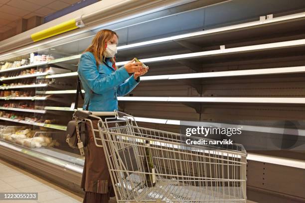 woman in the shop at empty shelves - sold out stock pictures, royalty-free photos & images