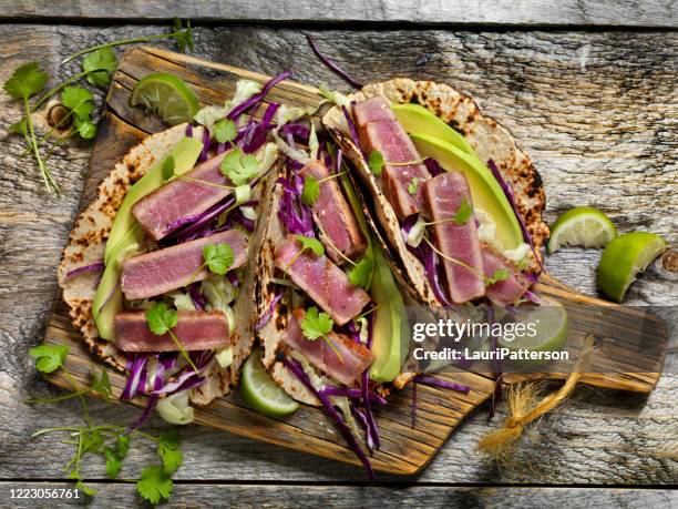 seared ahi tuna tacos and a beer - tuna stock pictures, royalty-free photos & images