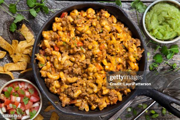 creamy beef taco macaroni and cheese - mac and cheese stock pictures, royalty-free photos & images