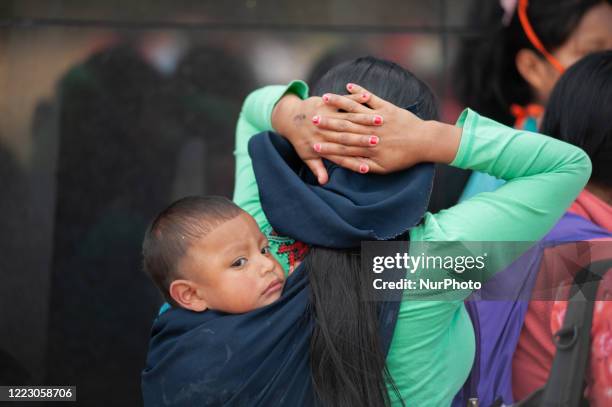 Members from the embera indigenous communities gather in Bogota to protest for justice after a 11 year old girl from their community was raped by 7...