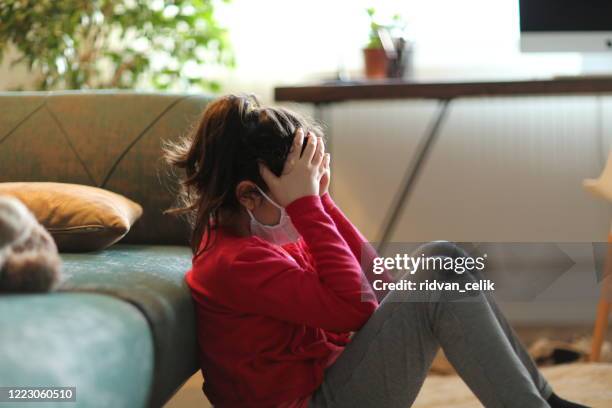 depressed kid during epidemic quarantine - covid anxiety stock pictures, royalty-free photos & images