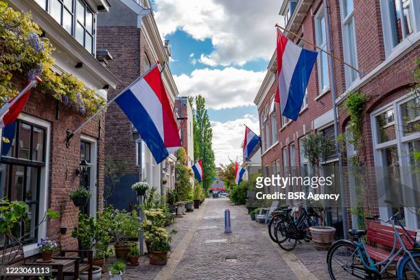 Flags are seen in a residential street at Liberation Day on May 5, 2020 in Haarlem, Netherlands. This year is has been exactly 75 years since The...
