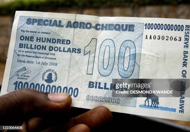 This picture taken on July 22, 2008 shows Zimbabwe's new 100 billion dollar note in Harare. Zimbabwe, now grappling with a record high 2.2 million...