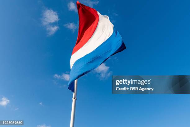 Flag is seen halfmast at Honorary Cemetery Bloemendaal on May 4, 2020 in Bloemendaal Netherlands during a sober commemoration of the dead at...