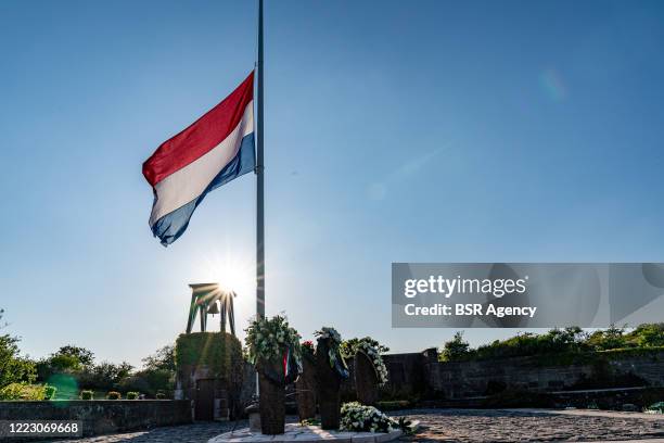 Flag is seen halfmast at Honorary Cemetery Bloemendaal on May 4, 2020 in Bloemendaal Netherlands during a sober commemoration of the dead at...