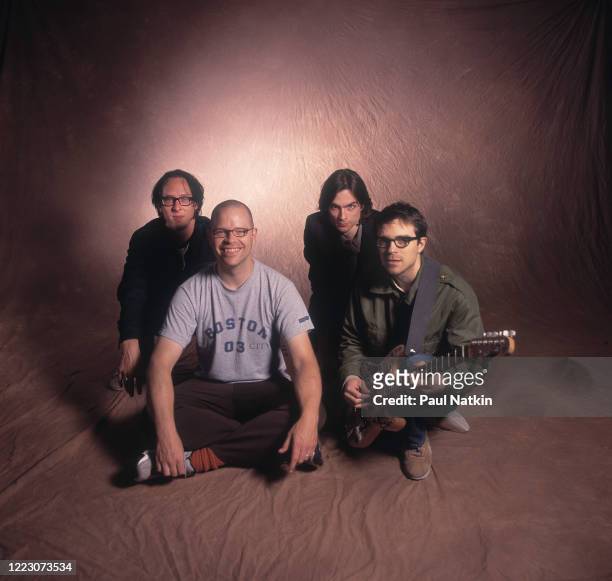 Portrait of members of the American Rock group Weezer as they pose backstage at the United Center, Chicago, Illinois, November 3, 2001. Pictured are...