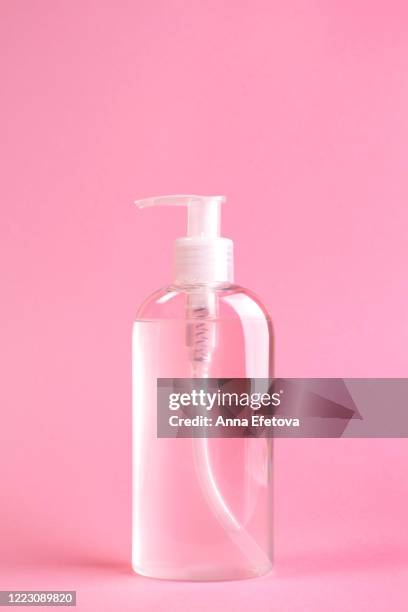 pump dispenser bottle with antibacterial gel inside. - laundry-detergent-containers stock pictures, royalty-free photos & images