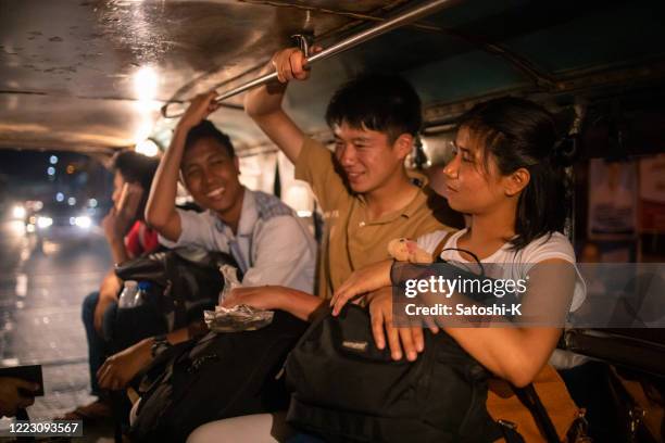 young asian friends talking in jeepney - manila streets stock pictures, royalty-free photos & images