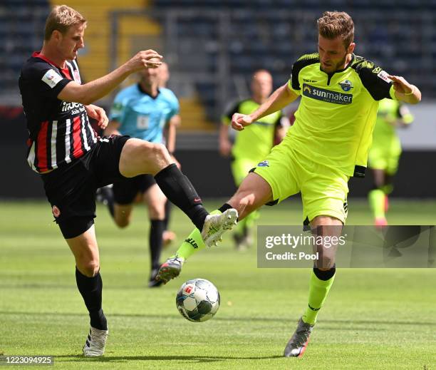 Martin Hinteregger of Eintracht Frankfurt and Dennis Srbeny of SC Paderborn 07 battle for the ball during the Bundesliga match between Eintracht...