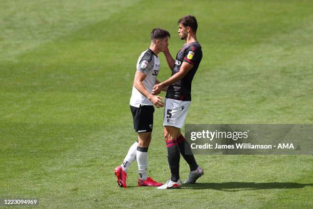 Tom Lawrence of Derby County clashes with Matt Miazga of Reading at full time of the Sky Bet Championship match between Derby County and Reading at...