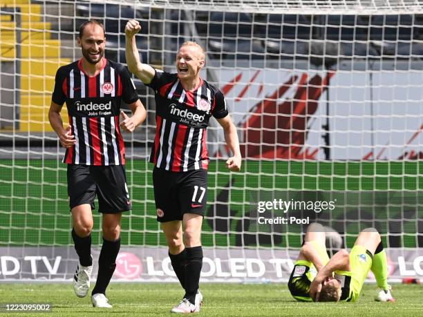 Sebastian Rode of Eintracht Frankfurt celebrates after scoring his team's first goal with teammate Bas Dost during the Bundesliga match between...